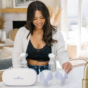 model using BabyBuddha breast pump in a cozy living room
