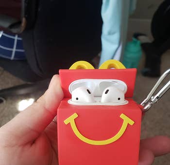 image of open mcdonald's airpod case in a reviewer's hand