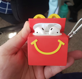 image of open mcdonald's airpod case in a reviewer's hand