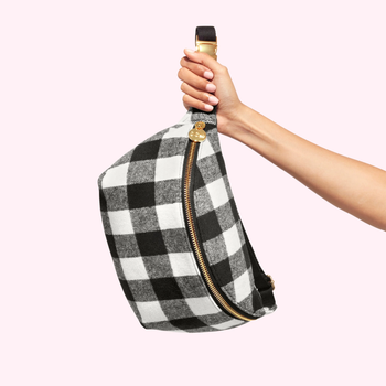 person holding gingham fanny pack