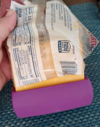 a reviewer photo of a food hugger on a block of cheese