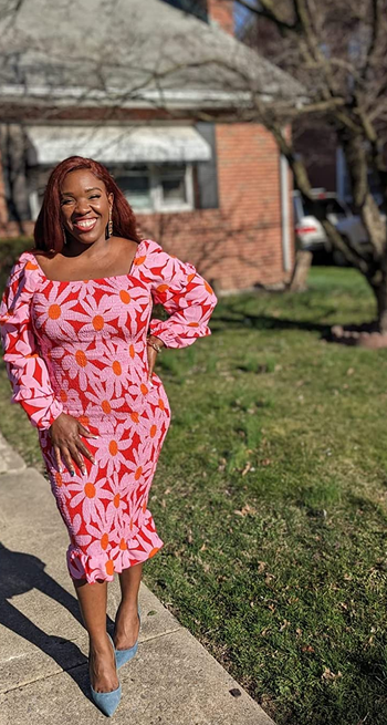 reviewer in the pink floral smocked dress
