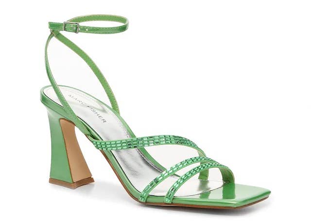 a strappy green sandal with an angled heel 
