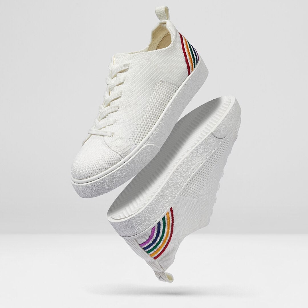 the white sneakers with rainbow detailing