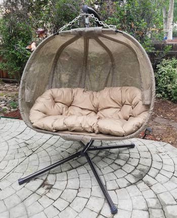 Reviewer image of chair with beige cushion