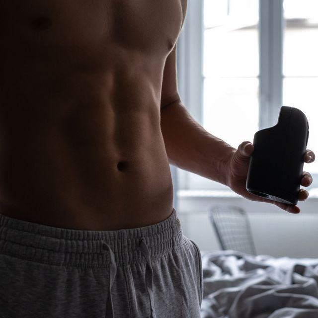 Model posing with masturbator