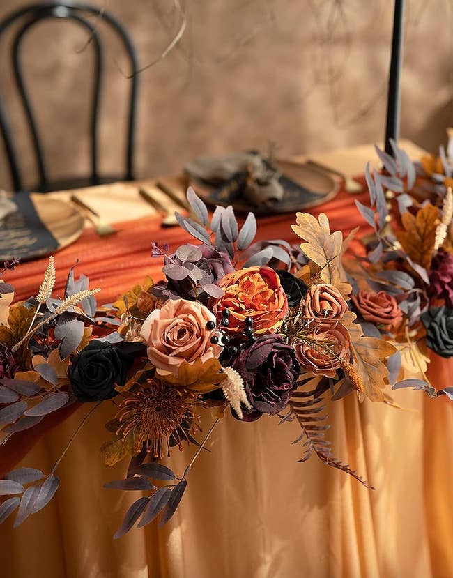garland on black and orange decorated table
