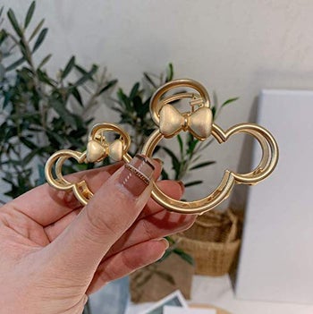 two gold minnie mouse claw clips in different sizes