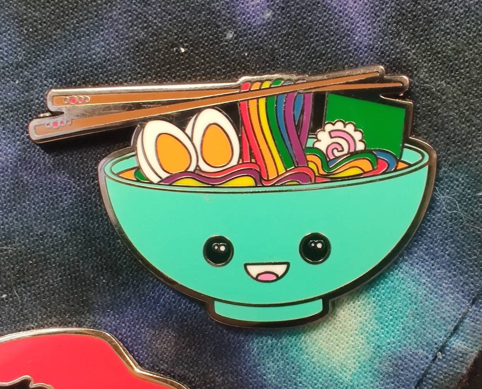 Green enamel bowl of ramen pin with rainbow noodles