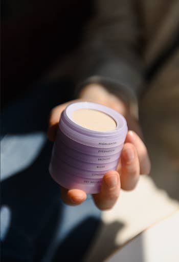 Hand holding a purple quality   stack
