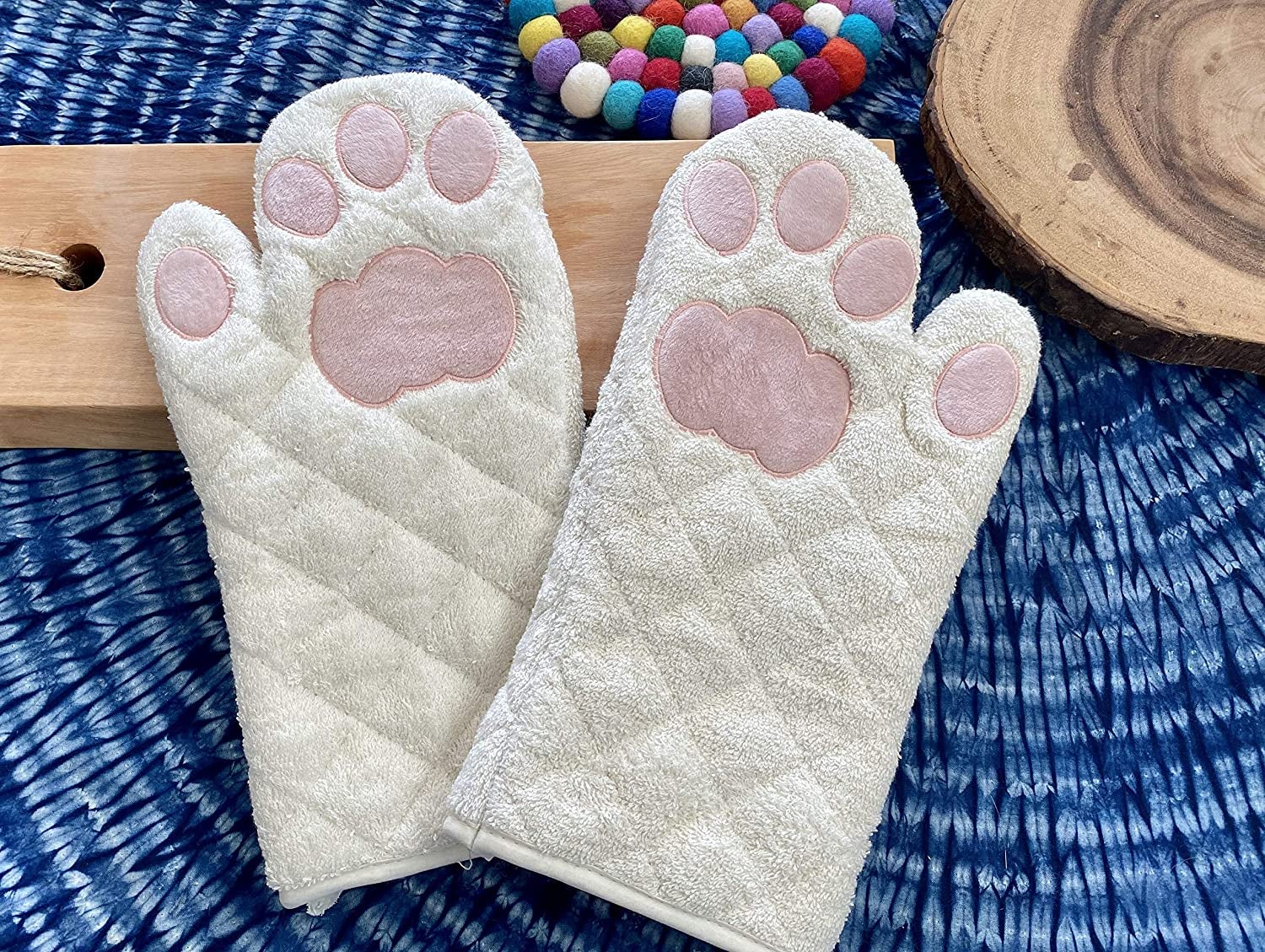 white oven mitts with pink paw prints