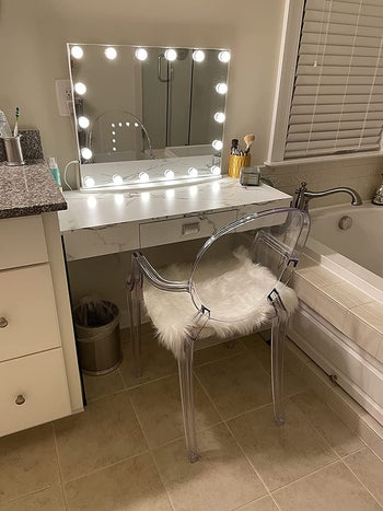reviewer photo of lighted vanity mirror on a desk