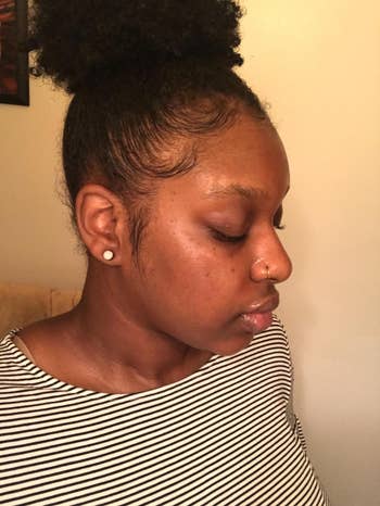 reviewer with hydrated, glowy looking skin after using the spray