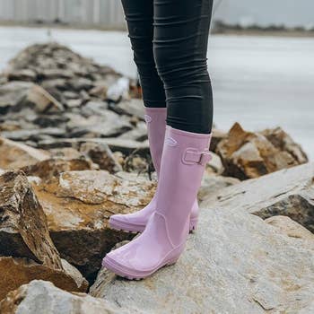 Person wearing lavender rain boots 