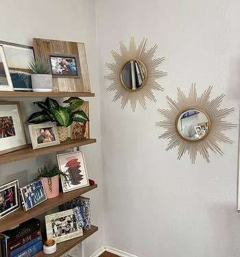 reviewer image of two starburst mirrors on a wall