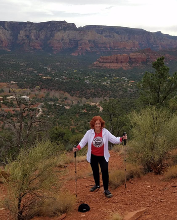 reviewer hiking with poles in sedona