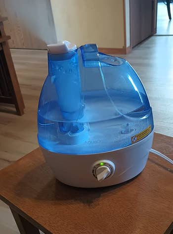 Reviewer's humidifier emitting steam on a table