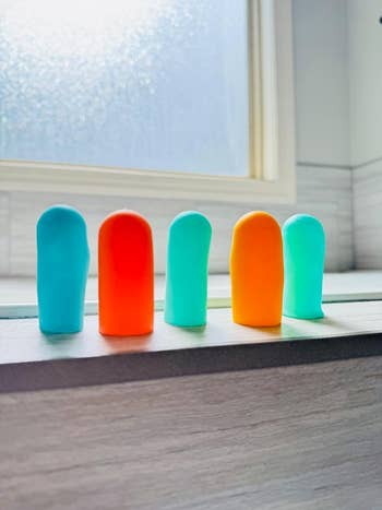 Five silicone covers in various colors