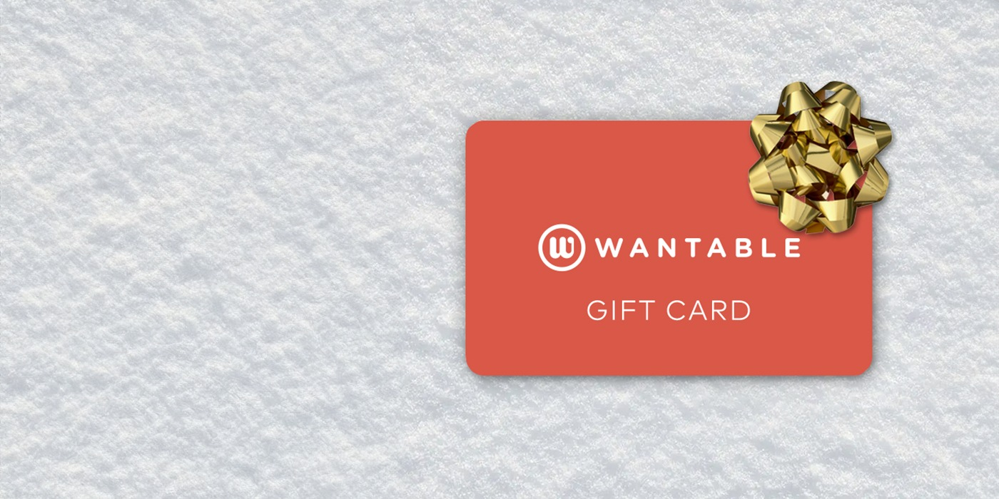 Wantable acquisition  paper  with a golden  bow connected  a textured background