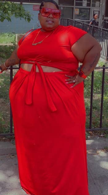 reviewer wearing the red skirt set
