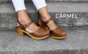 model's feet wearing the brown clogs