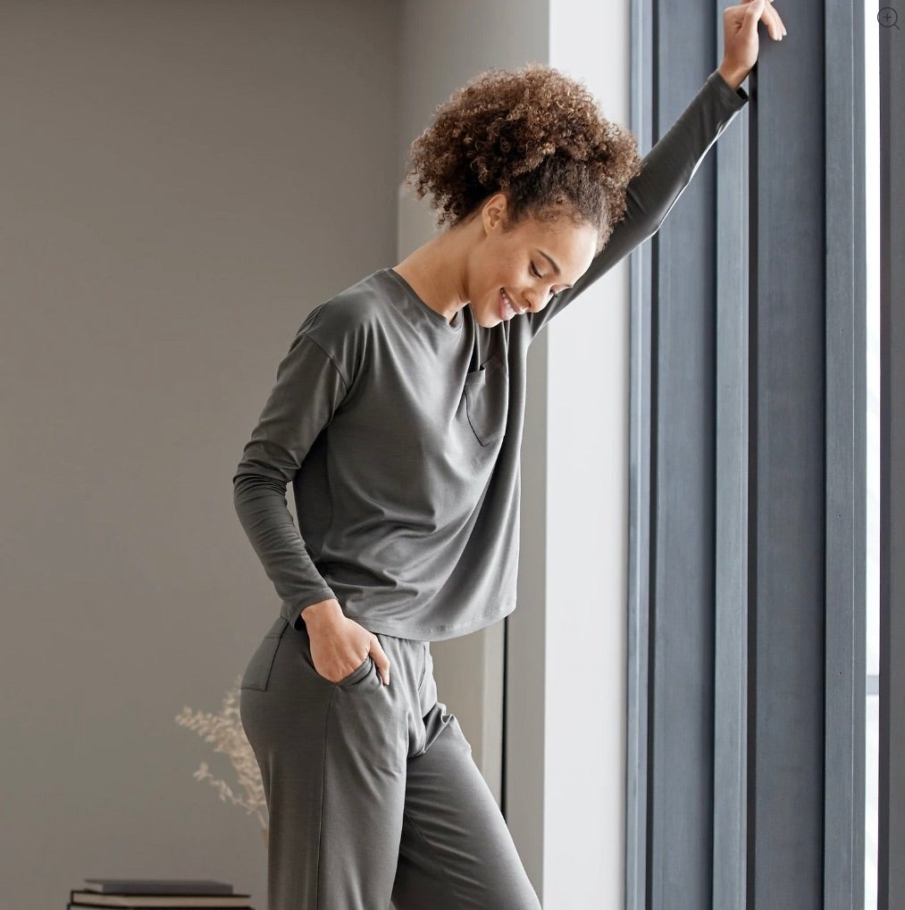 model wearing the grey long sleeve top