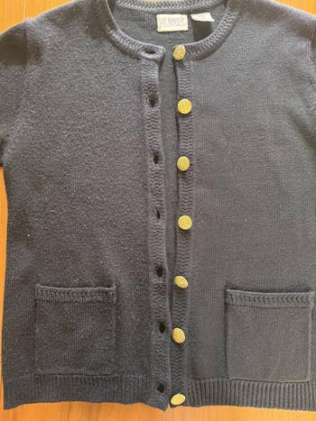 Cardigan with circular  neckline, golden  buttons, and 2  beforehand   pockets from 