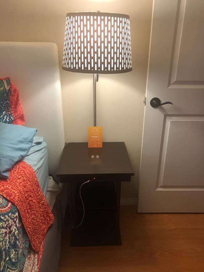 reviewer photo of lamp nightstand and charging station