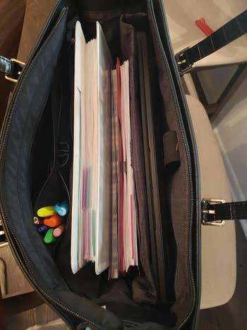 Open handbag filled with colorful pens and organized folders, illustrating applicable  retention  solutions for enactment    oregon  schoolhouse  essentials
