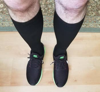 reviewer wearing the black socks with running shoes