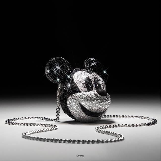 a bedazzled bag shaped like mickey mouse's head