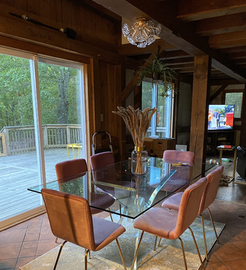 another review image showing the light from far away above a dining room set