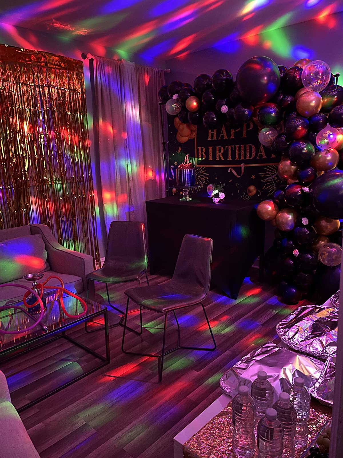 a reviewer photo of a party room lit by the strobe light 