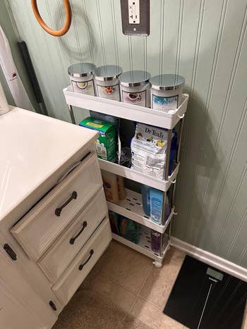 another reviewer's achromatic  cart storing bath  supplies and wedged betwixt  bath  descend  and wall
