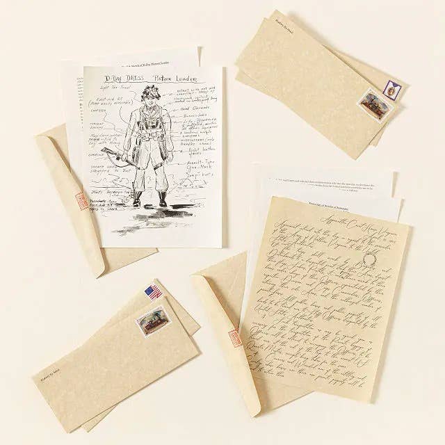 Handwritten letters and a drafting  of a worker  are arranged with stamped envelopes connected  a surface