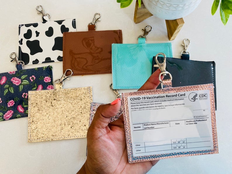eight different vaccine card holders in various prints, colors, and glitter