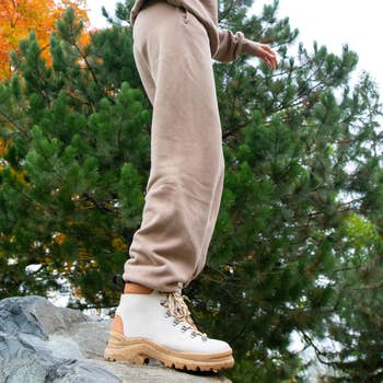 model wearing the hiking boot in white