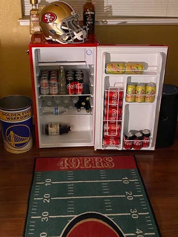 Reviewer image of interior of product with cans on shelves