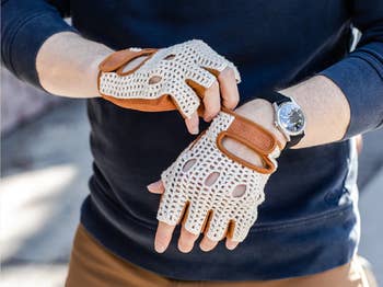 lifestyle image of model putting on crocheted bike gloves