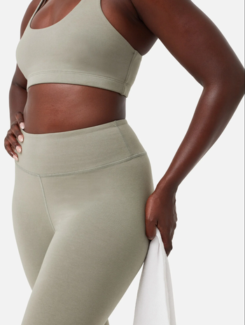 a close up image of a model wearing the organic stretch legging