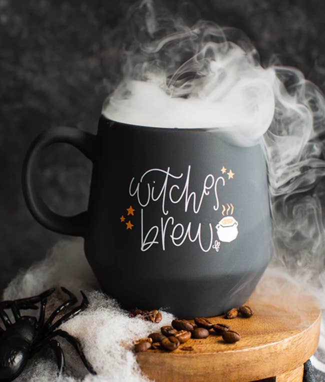 black cauldron mug that says 