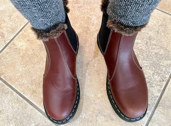 a reviewer wearing the boots in brown