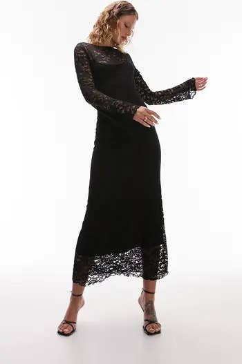 model in long sheer black lace dress