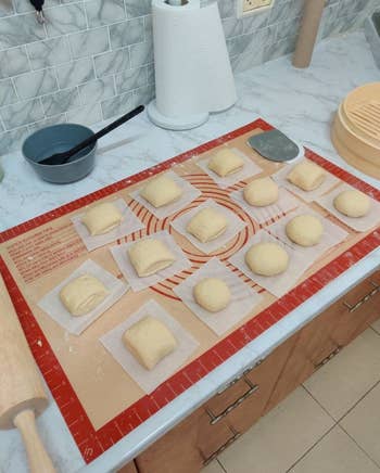 reviewer photo of dough portioned out on the silicone baking mat