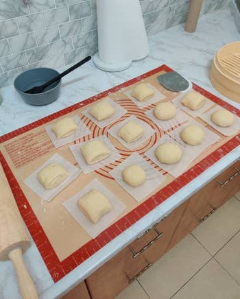 reviewer photo of dough portioned out on the silicone baking mat
