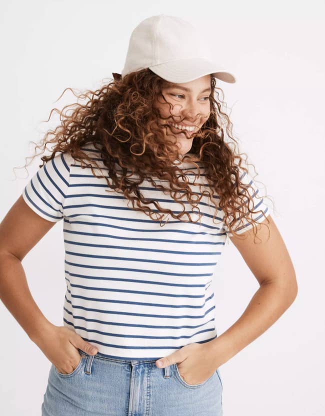 model wearing cream baseball cap