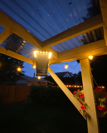 closeup of reviewer's speaker hanging from deck