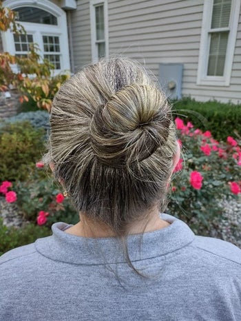a reviewer's neatly pinned bun