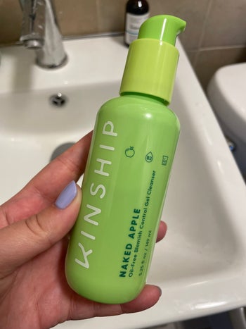 a green bottle of kinship gel cleanser
