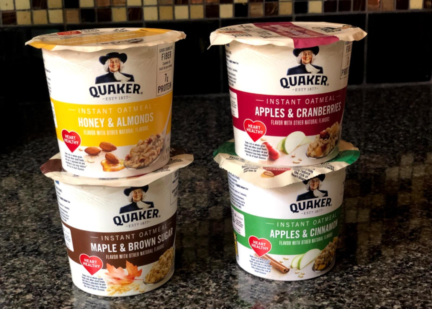 a reviewer photo of the different flavors of oatmeal that come in the pack